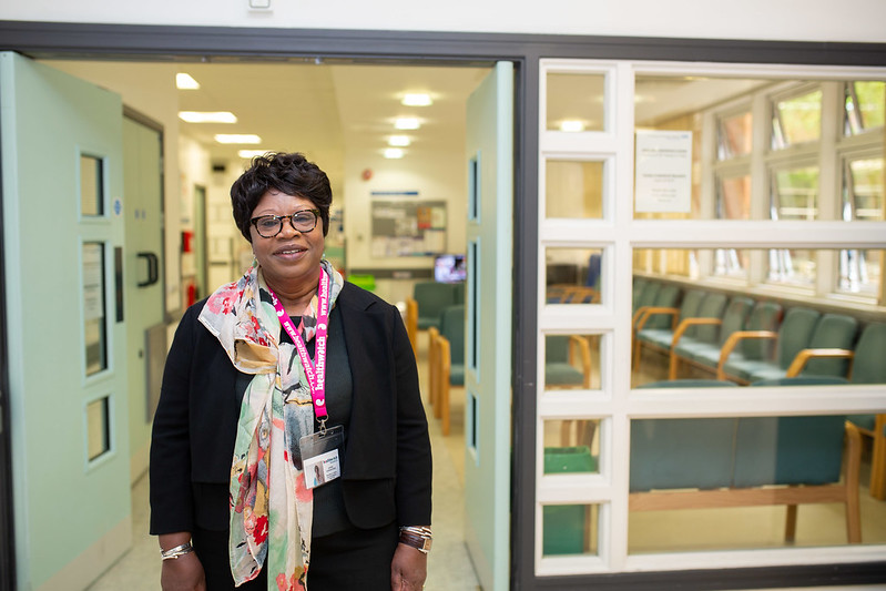 A woman standing outside a medical centre