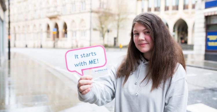 #coping young persons guide young girl holding up a sign that says it starts with me