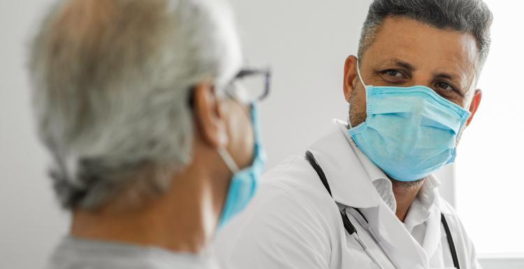 Doctor talking to a senior patient at home Doctor talking to a senior patient at home
