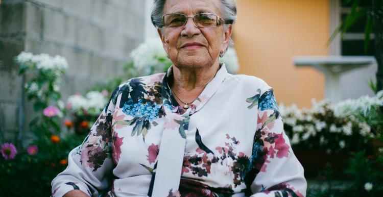 Elderly woman sitting outside Elderly woman sitting outside