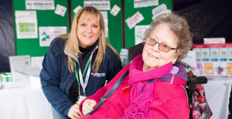 Healthwatch volunteer speaking to an elderly lady at an event Healthwatch volunteer speaking to an elderly lady at an event
