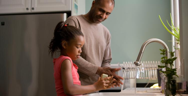 Father and daughter washing hands Father and daughter washing hands