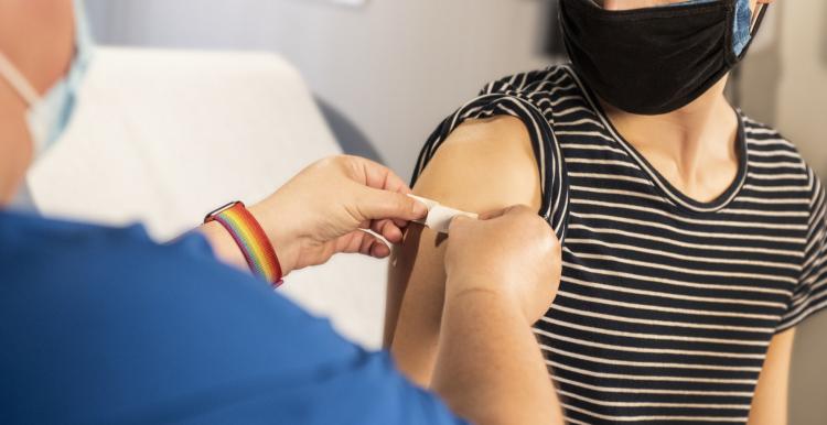 young person being vaccinated