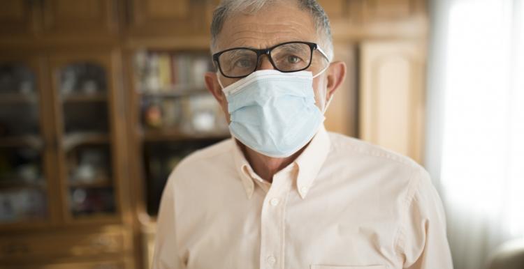 Elderly man wearing a mask Elderly man wearing a mask