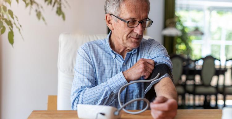 Man measuring his blood pressure