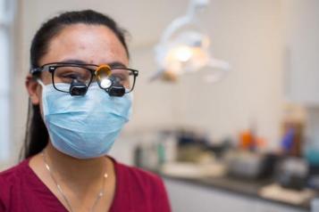 Smiling dentist with mask