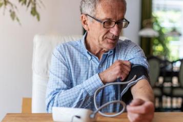 Man measuring his blood pressure