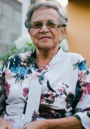 Elderly woman sitting outside