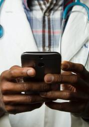 Doctor looking at a mobile phone