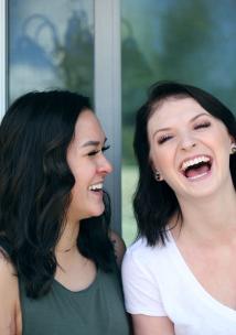 two women laughing together